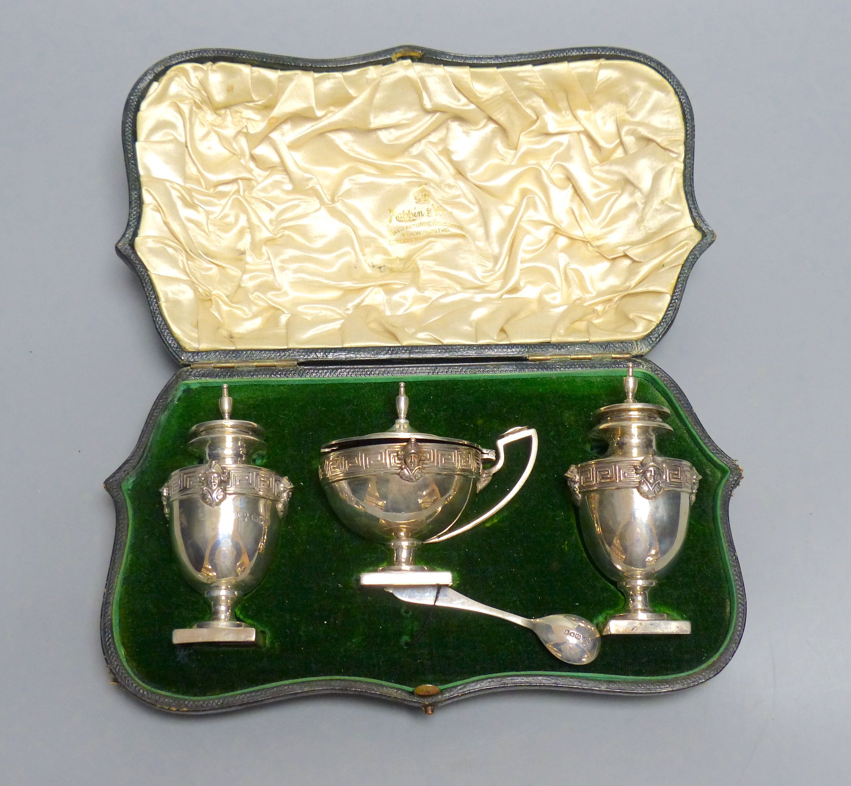 A cased Edwardian silver three piece condiment set